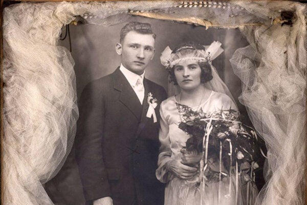 Shadowbox with a wedding photograph of a bride and groom, surrounded by the bride's veil