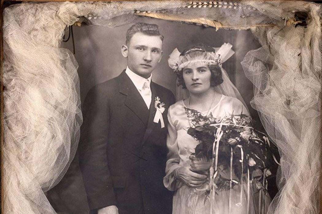 Shadowbox with a wedding photograph of a bride and groom, surrounded by the bride's veil