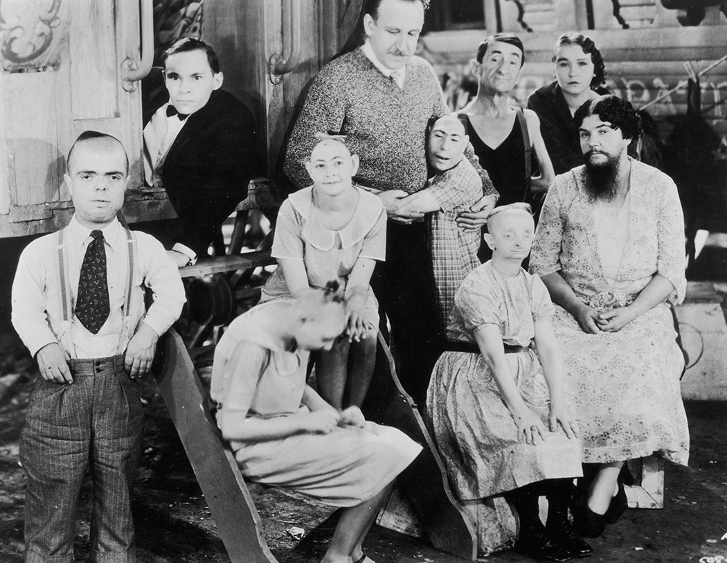Tod Browning (back row; third from right) posing on set with the cast of his circus film, 'Freaks'. Amongst the cast members are Josephine Joseph, Johnny Eck, Peter Robinson and Olga Roderick.