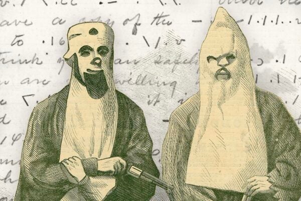 Two Members Of The Ku-Klux Klan in front of a cipher