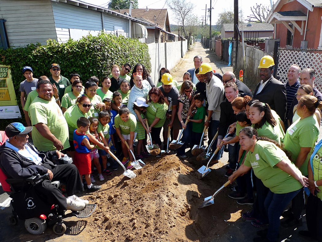 A group of people working on the Green Alleyway project