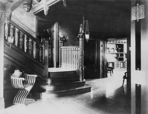 A carved staircase from the entrance hall to the ballroom of the Sylvester T. Everett Residence, ca. 1886