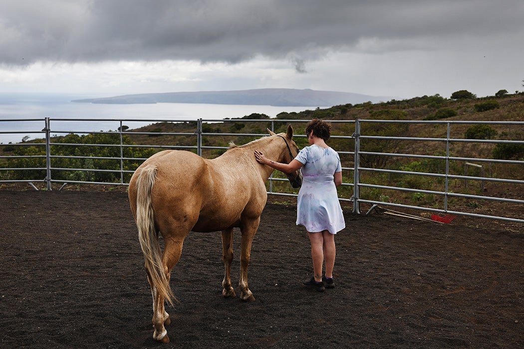 A woman receiving equine-assisted therapy at Spirit Horse Ranch near Kula, Hawaii.