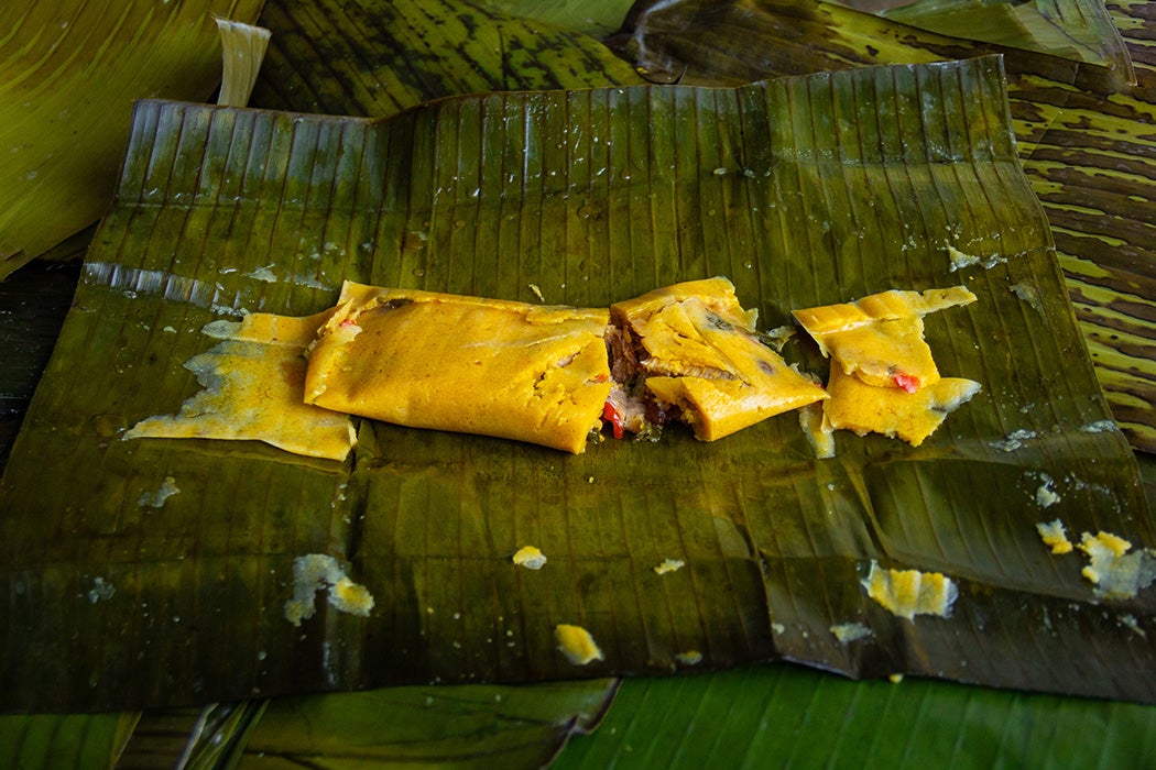 Hallaca. Corn dough stuffed with a stew of beef and other ingredients wrapped in banana leaf.