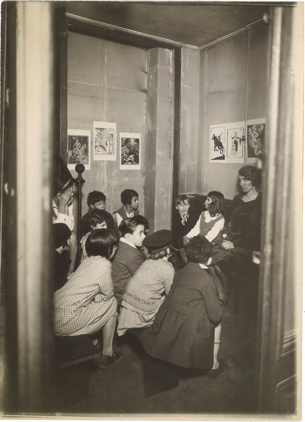 Story hour in children's room, a small space at base of a stairwell.