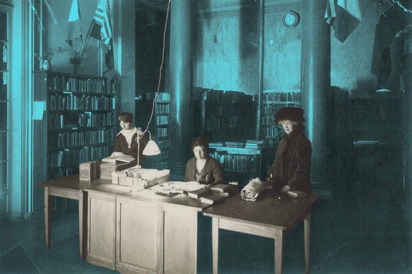 Low counter circulation desk with three women.