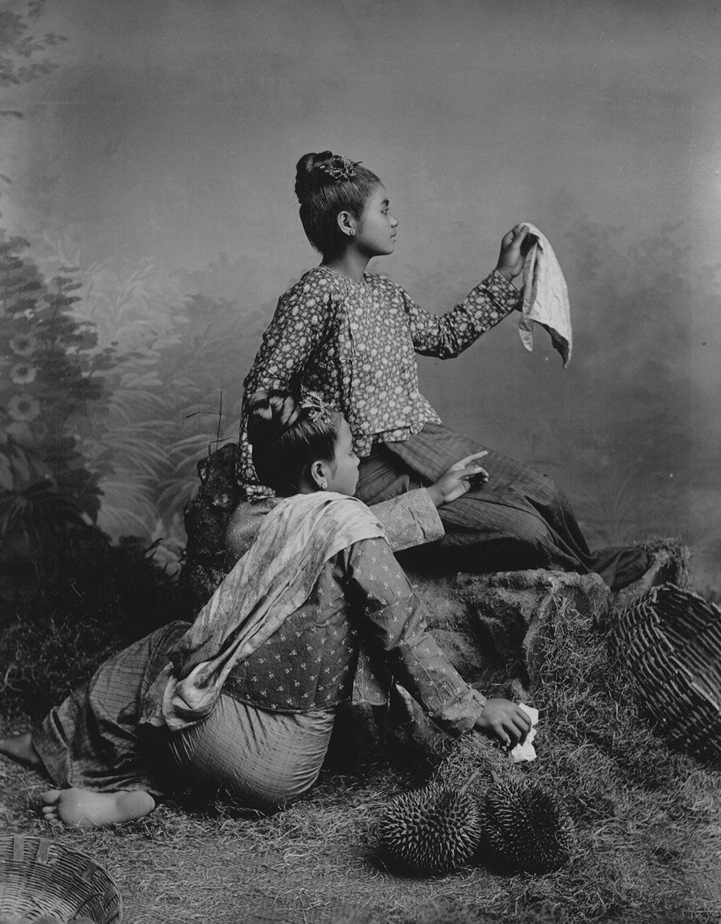 Burmese girls posing with two durians in the foreground in Myanmar, by German photographer Philipp Adolphe Klier, 1845-1911, via JSTOR. His photos were highly staged to depict an exoticized Orient for European audiences, who received these images in newspapers and postcards.