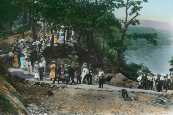 Lantern slide of people on path up from boat dock in Palisades Interstate Park, 1917